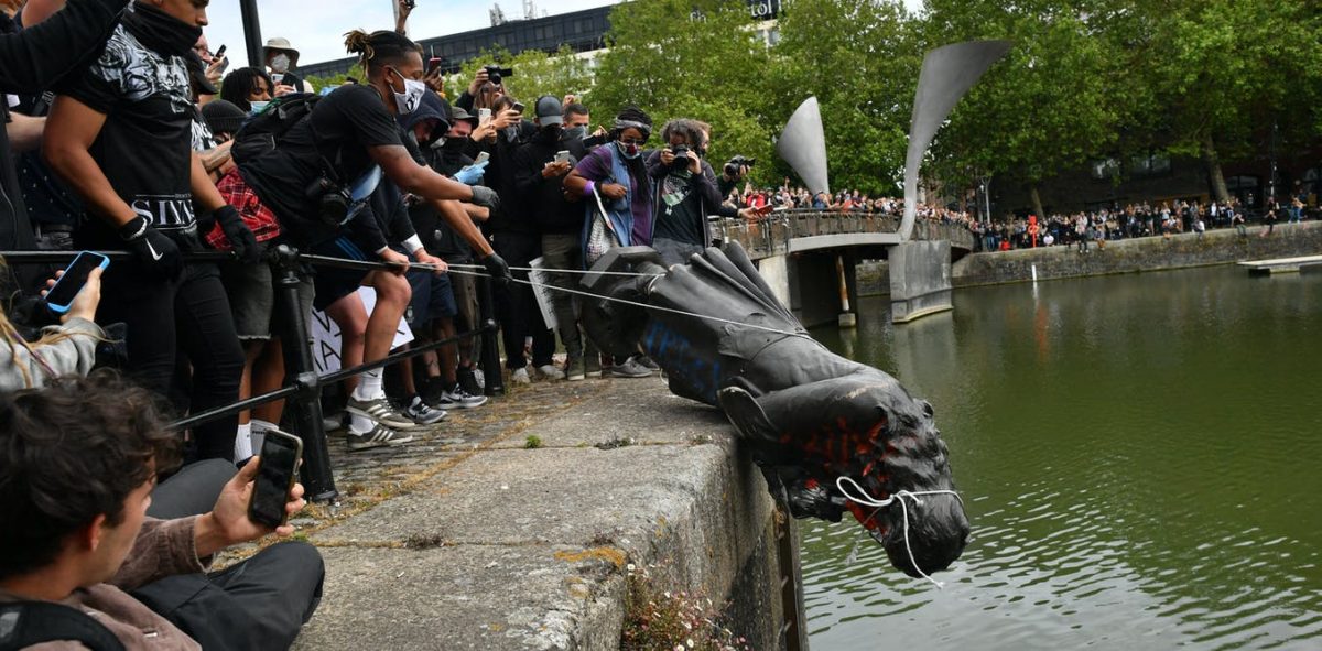 The statue of Edward Colston is thrown into Bristol harbour as part of the black lives matter protest.