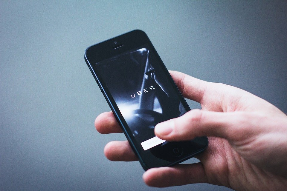 someone holding a phone with uber