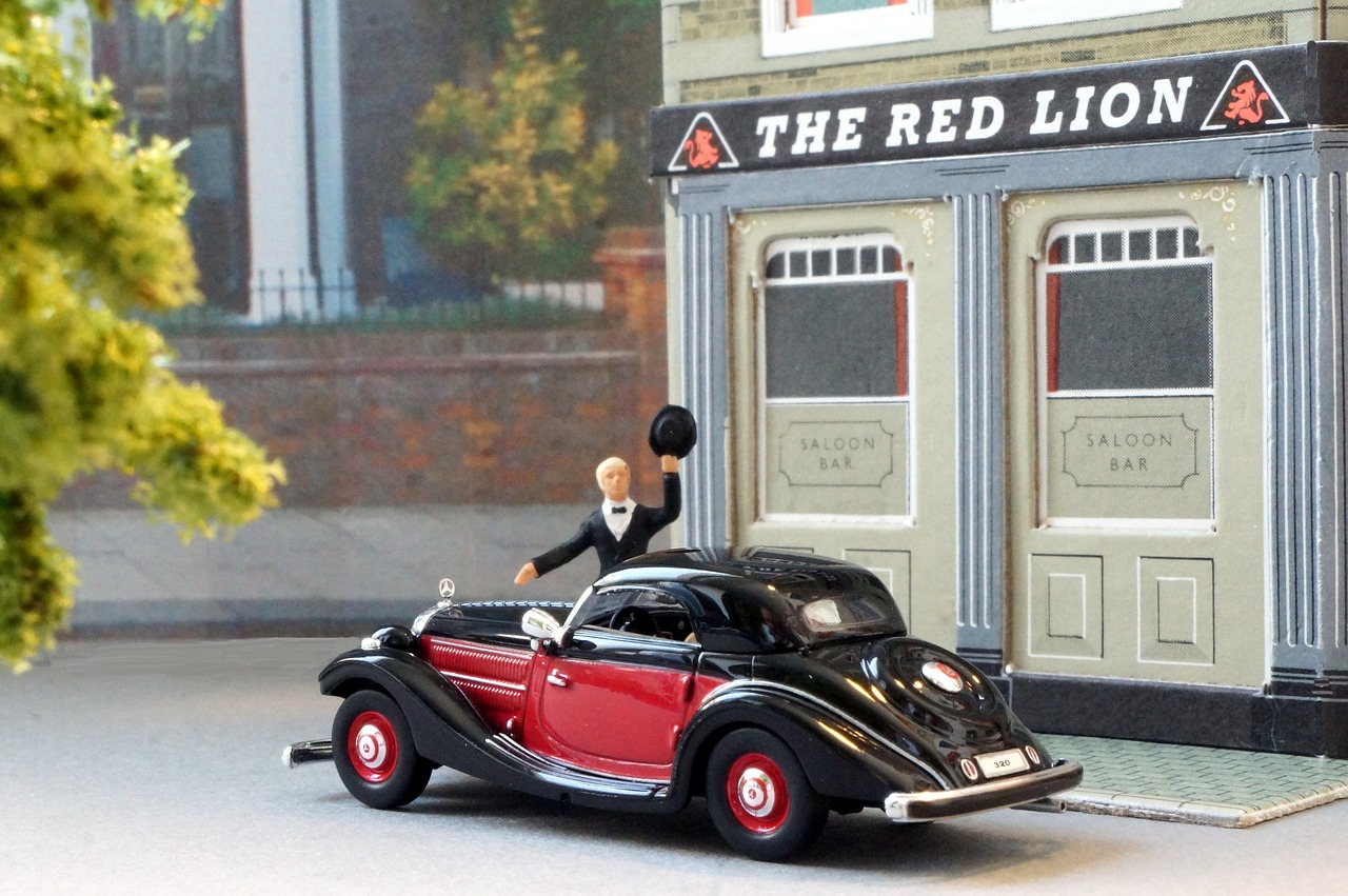 A red model car outside the reldlion pub